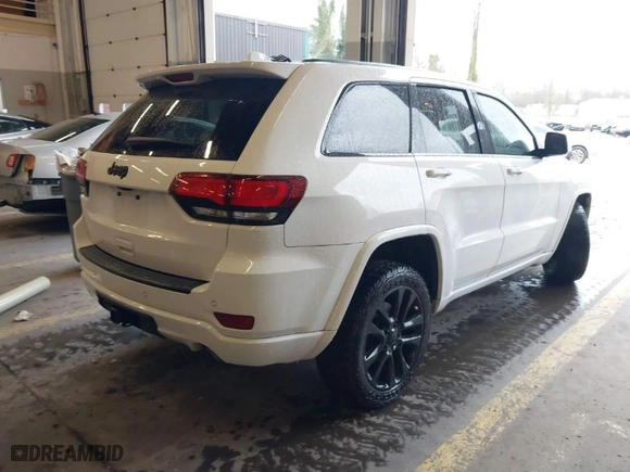 2019 Jeep Grand Cherokee Laredo E with VIN 1C4RJFAG1KC818289, listed as a IAAI auction lot 41602541 with 59,356 mi miles. Bid and sale history available at carsss.com. Image 4.