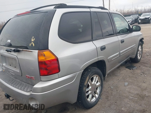 2004 GMC Envoy SLE with VIN 1GKDT13SX42135951, listed as a IAAI auction lot 41668252 with 216,193 mi miles. Bid and sale history available at carsss.com. Image 4.