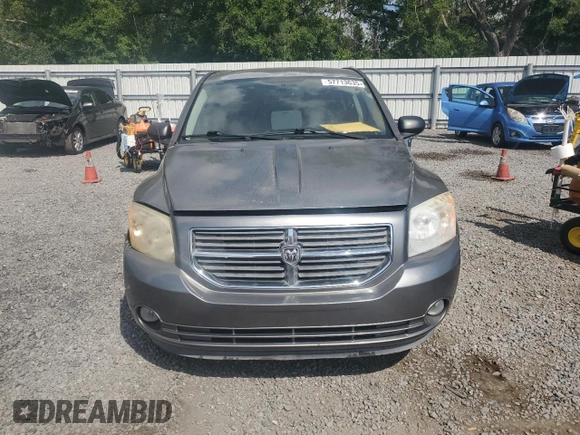 2011 Dodge Caliber Mainstreet z VIN 1B3CB3HA1BD237714, wystawiony jako Copart lot #57713635 z przebiegiem 147 998 mil mil oraz Szkody całkowita. Historia ofert i sprzedaży dostępna na DreamBid. Obrazek 5.