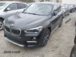 2018 BMW X1 xDrive28i with VIN WBXHT3C34J5K21576, listed as a IAAI auction lot 41822390 with 69,645 mi miles. Bid and sale history available at carsss.com. Image 2.
