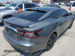 2020 Nissan Maxima SR with VIN 1N4AA6EVXLC383592, listed as a IAAI auction lot 42058071 with 103,014 mi miles and . Bid and sale history available at DreamBid. Image 4.