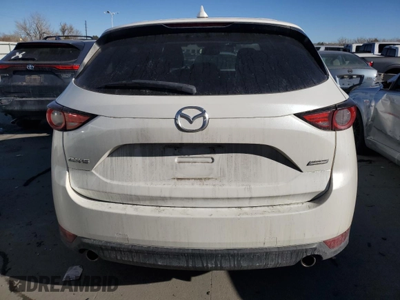 2018 Mazda CX-5 Grand Touring with VIN JM3KFADM3J1410210, listed as a Copart auction lot 44031365 with 69,016 mi miles and Clean Title. Bid and sale history available at DreamBid. Image 6.