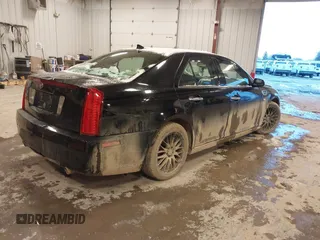 2010 Cadillac STS AWD with VIN 1G6DU6EV2A0125065, listed as a IAAI auction lot 41229886 with 84,954 mi miles and . Bid and sale history available at DreamBid. Image 4.