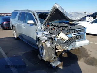 2015 Chevrolet Suburban LT with VIN 1GNSCJKC6FR646684, listed as a IAAI auction lot 41599832 with 143,951 mi miles. Bid and sale history available at carsss.com. Image 1.