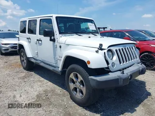 2018 Jeep Wrangler Unlimited Sahara with VIN 1C4BJWEG3JL805263, listed as a IAAI auction lot 42593276 with 96,489 mi miles and . Bid and sale history available at DreamBid. Image 1.