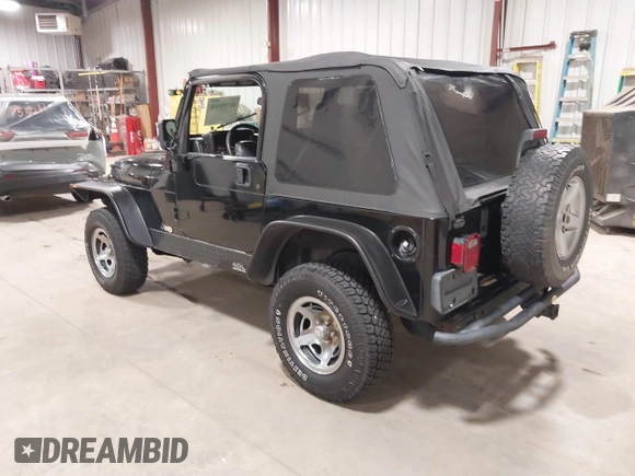 2002 Jeep Wrangler Sport with VIN 1J4FA49S02P704741, listed as a IAAI auction lot 41759558 with 191,126 mi miles. Bid and sale history available at carsss.com. Image 3.