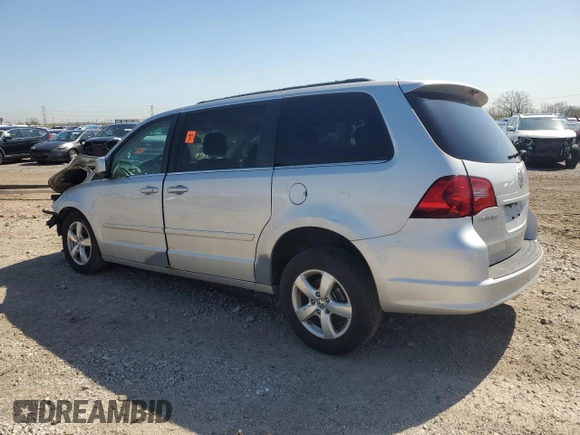 2011 Volkswagen Routan SE with VIN 2V4RW3DG0BR621820, listed as a Copart auction lot 87670825 with 180,222 mi miles and Salvage title. Bid and sale history available at DreamBid. Image 2.