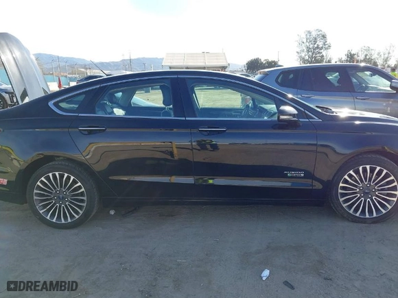 2017 Ford Fusion Energi SE with VIN 3FA6P0PU7HR373391, listed as a IAAI auction lot 41677525 with 99,499 mi miles. Bid and sale history available at carsss.com. Image 13.