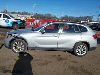 2013 BMW X1 xDrive28i with VIN WBAVL1C57DVR84747, listed as a IAAI auction lot 41273794 with 93,738 mi miles. Bid and sale history available at carsss.com. Image 14.