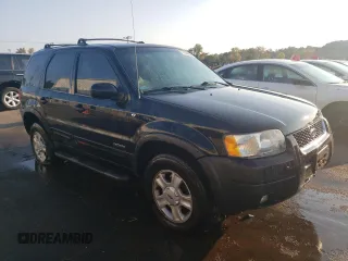 2001 Ford Escape XLT with VIN 1FMCU04141KB40767, listed as a Copart auction lot 71492664 with 118,541 mi miles and Salvage Title. Bid and sale history available at carsss.com. Image 4.