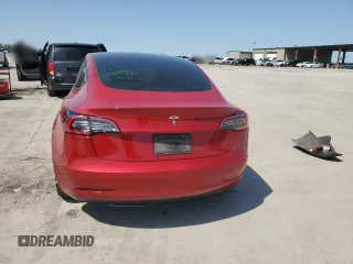 2021 Tesla Model 3 Standard Range Plus with VIN 5YJ3E1EA7MF915053, listed as a Copart auction lot 51172815 with 69,303 mi miles and Salvage Title. Bid and sale history available at DreamBid. Image 6.