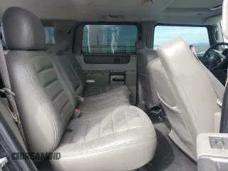 2004 Hummer H2 z VIN 5GRGN23U74H100175, wystawiony jako Copart lot #52642125 z przebiegiem 112 305 mil mil oraz Szkoda całkowita • Salvage title. Historia ofert i sprzedaży dostępna na DreamBid. Obrazek 11.