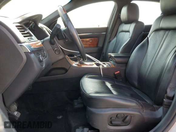 2013 Lincoln MKS with VIN 1LNHL9EK0DG612314, listed as a Copart auction lot 52901685 with 124,828 mi miles and Salvage title. Bid and sale history available at DreamBid. Image 7.