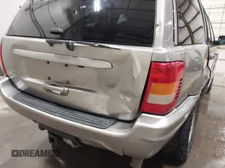 1999 Jeep Grand Cherokee Limited with VIN 1J4GW68N7XC752314, listed as a IAAI auction lot 41776905 with 228,023 mi miles. Bid and sale history available at carsss.com. Image 18.