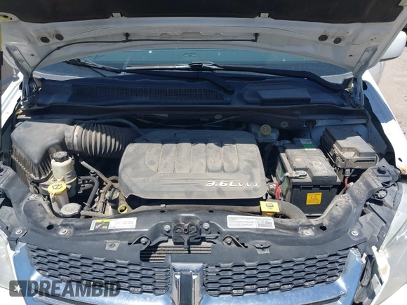 2014 Dodge Grand Caravan SXT with VIN 2C4RDGCG1ER429495, listed as a IAAI auction lot 42058513 with 136,936 mi miles and . Bid and sale history available at DreamBid. Image 10.