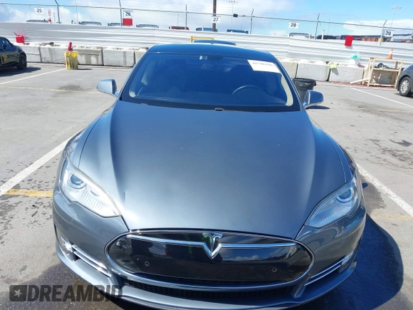 2014 Tesla Model S 60 with VIN 5YJSA1S15EFP29010, listed as a IAAI auction lot 41798180 with 142,754 mi miles and . Bid and sale history available at DreamBid. Image 12.