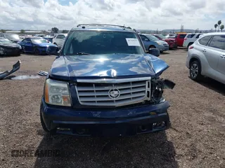 2004 Cadillac Escalade z VIN 1GYEC63T34R273497, wystawiony jako IAAI lot #41719537 z przebiegiem 256 975 mil mil oraz . Historia ofert i sprzedaży dostępna na DreamBid. Obrazek 12.
