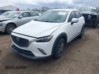 2016 Mazda CX-3 Grand Touring with VIN JM1DKFD73G0129737, listed as a IAAI auction lot 41875808 with 120,547 mi miles. Bid and sale history available at carsss.com. Image 2.