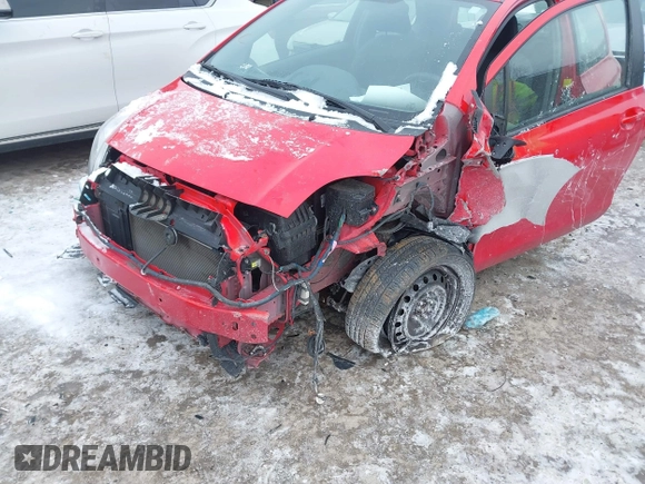 2011 Toyota Yaris with VIN JTDJT4K34B5329980, listed as a IAAI auction lot 41393540 with 84,987 mi miles. Bid and sale history available at carsss.com. Image 6.