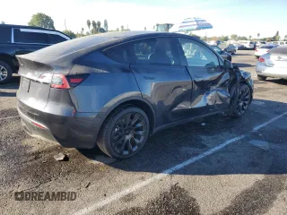 2024 Tesla Model Y Long Range с VIN 7SAYGDEE3RA236473, выставлен на аукционе Copart как лот 77409334 с пробегом 5 822 миль миль и Списание • Salvage title. История ставок и продаж доступна на DreamBid. Изображение 3.
