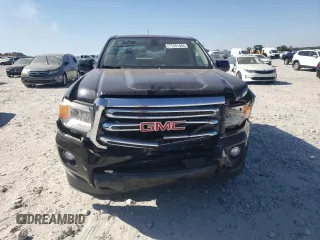 2015 GMC Canyon 2WD SLE with VIN 1GTG5BEA6F1221120, listed as a Copart auction lot 77391484 with 180,334 mi miles and Salvage Title. Bid and sale history available at carsss.com. Image 5.
