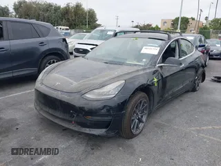 2019 Tesla Model 3 Mid Range with VIN 5YJ3E1EA2KF362048, listed as a IAAI auction lot 40141734 with 70,321 mi miles and . Bid and sale history available at carsss.com. Image 18.