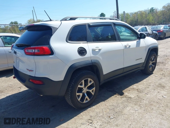 2014 Jeep Cherokee Trailhawk with VIN 1C4PJMBS8EW163212, listed as a IAAI auction lot 42124107 with 114,999 mi miles. Bid and sale history available at carsss.com. Image 4.