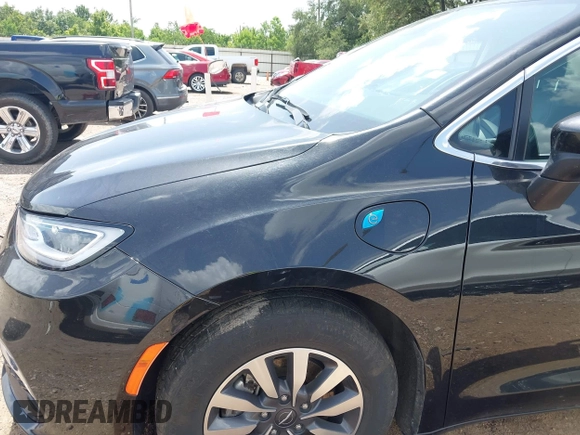 2023 Chrysler Pacifica Hybrid Touring L with VIN 2C4RC1L70PR622000, listed as a IAAI auction lot 42711826 with 65,109 mi miles and . Bid and sale history available at DreamBid. Image 6.
