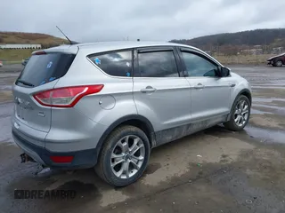 2013 Ford Escape SEL with VIN 1FMCU9H93DUA81448, listed as a IAAI auction lot 41790631 with 176,015 mi miles. Bid and sale history available at carsss.com. Image 4.