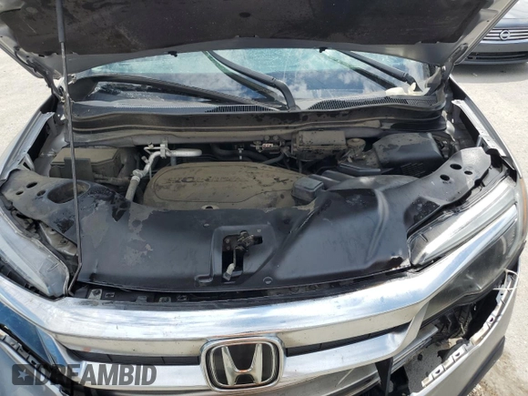 2021 Honda Pilot EX-L z VIN 5FNYF5H58MB008921, wystawiony jako Copart lot #56985395 z przebiegiem Nie podano mil oraz Szkoda całkowita • Salvage title. Historia ofert i sprzedaży dostępna na DreamBid. Obrazek 12.