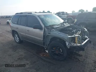 2002 GMC Envoy SLE z VIN 1GKDS13S122357410, wystawiony jako IAAI lot #42355556 z przebiegiem Nie podano mil oraz . Historia ofert i sprzedaży dostępna na DreamBid. Obrazek 1.