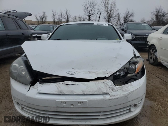 2008 Hyundai Tiburon GS z VIN KMHHM66DX8U290154, wystawiony jako Copart lot #67054434 z przebiegiem 191 963 mil mil oraz Nie do naprawy • Non repairable. Historia ofert i sprzedaży dostępna na DreamBid. Obrazek 5.