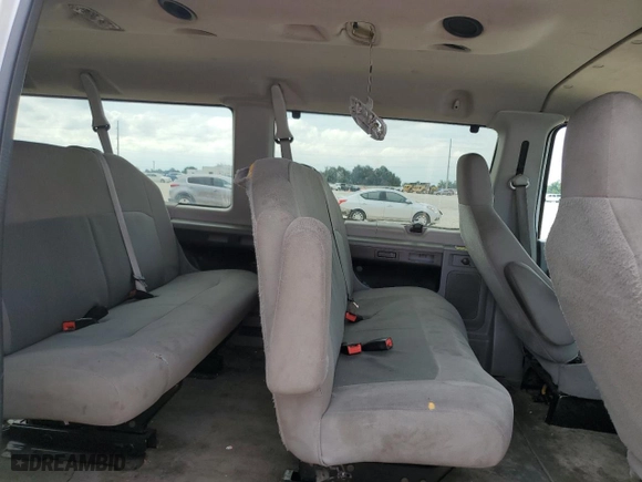 2014 Ford Econoline Wagon XL with VIN 1FBNE3BL4EDA25746, listed as a Copart auction lot 69606994 with 107,842 mi miles and Salvage Title. Bid and sale history available at carsss.com. Image 12.