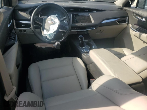 2022 Cadillac XT4 FWD Luxury with VIN 1GYAZAR4XNF121008, listed as a Copart auction lot 77599974 with 29,141 mi miles and Salvage title. Bid and sale history available at DreamBid. Image 8.