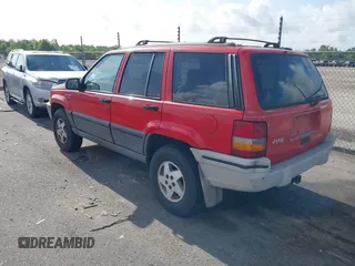 1995 Jeep Grand Cherokee Laredo with VIN 1J4FX58S9SC686074, listed as a IAAI auction lot 42451786 with 82,249 mi miles and . Bid and sale history available at DreamBid. Image 3.
