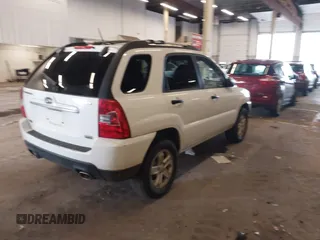 2009 Kia Sportage LX with VIN KNDJE723497563630, listed as a IAAI auction lot 41911423 with 213,040 mi miles. Bid and sale history available at carsss.com. Image 4.
