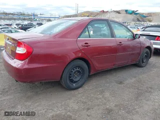 2004 Toyota Camry LE with VIN 4T1BE32K84U307551, listed as a IAAI auction lot 42054571 with 115,513 mi miles. Bid and sale history available at carsss.com. Image 4.
