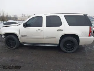2011 GMC Yukon Denali with VIN 1GKS2EEFXBR137172, listed as a IAAI auction lot 41930576 with 117,246 mi miles. Bid and sale history available at carsss.com. Image 14.