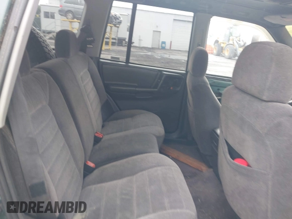 1996 Jeep Grand Cherokee with VIN 1J4EZ58Y7TC128302, listed as a IAAI auction lot 42643449 with 282,036 mi miles and . Bid and sale history available at DreamBid. Image 8.