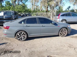 2019 Volkswagen Jetta GLI S z VIN 3VW6T7BU5KM169132, wystawiony jako IAAI lot #41599605 z przebiegiem 59 744 mil mil oraz . Historia ofert i sprzedaży dostępna na DreamBid. Obrazek 13.