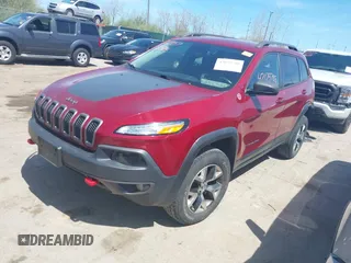 2016 Jeep Cherokee Trailhawk with VIN 1C4PJMBS9GW237059, listed as a IAAI auction lot 42079788 with 114,513 mi miles. Bid and sale history available at carsss.com. Image 2.