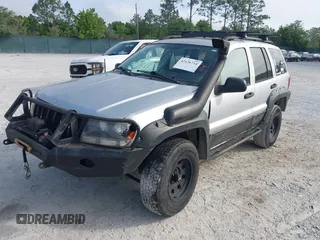 2003 Jeep Grand Cherokee Laredo z VIN 1J8GW48S33C519680, wystawiony jako IAAI lot #42126714 z przebiegiem 295 517 mil mil oraz . Historia ofert i sprzedaży dostępna na DreamBid. Obrazek 17.