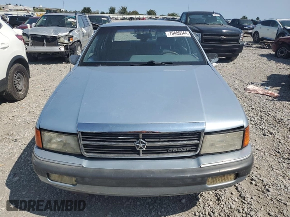1989 Dodge Spirit z VIN 1B3BA46K1KF408949, wystawiony jako Copart lot #80767594 z przebiegiem 137 766 mil mil oraz Nie do naprawy. Historia ofert i sprzedaży dostępna na DreamBid. Obrazek 5.