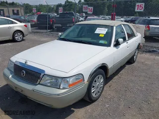 2004 Mercury Grand Marquis GS with VIN 2MEFM74W44X673224, listed as a IAAI auction lot 40670734 with 83,219 mi miles. Bid and sale history available at carsss.com. Image 2.