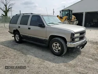 1999 Chevrolet Tahoe Z71 with VIN 1GNEK13R6XJ301562, listed as a Copart auction lot 59684595 with 200,561 mi miles and Salvage title. Bid and sale history available at DreamBid. Image 14.