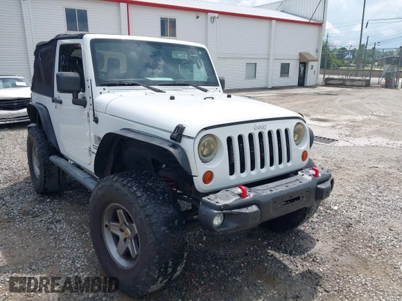2012 Jeep Wrangler Sport z VIN 1C4AJWAG5CL171961, wystawiony jako IAAI lot #42590232 z przebiegiem 126 372 mil mil oraz . Historia ofert i sprzedaży dostępna na DreamBid. Obrazek 1.