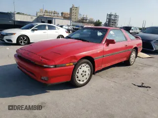 1988 Toyota Supra z VIN JT2MA71JXJ0094266, wystawiony jako Copart lot #59028715 z przebiegiem 133 654 mil mil oraz Czysty tytuł • Clean title. Historia ofert i sprzedaży dostępna na DreamBid. Obrazek 1.