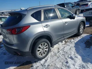 2013 Mazda CX-5 Touring with VIN JM3KE2CE7D0129623, listed as a IAAI auction lot 41344623 with 147,025 mi miles. Bid and sale history available at carsss.com. Image 4.