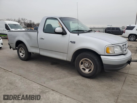 2002 Ford F-150 XL with VIN 1FTRF172X2NB77521, listed as a Copart auction lot 43993885 with 339,289 mi miles and Salvage Title. Bid and sale history available at carsss.com. Image 4.