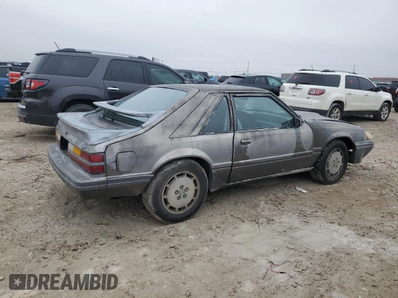 1986 Ford Mustang with VIN 1FABP28T8GF109009, listed as a Copart auction lot 83148544 with 329,005 mi miles and Salvage title. Bid and sale history available at DreamBid. Image 3.